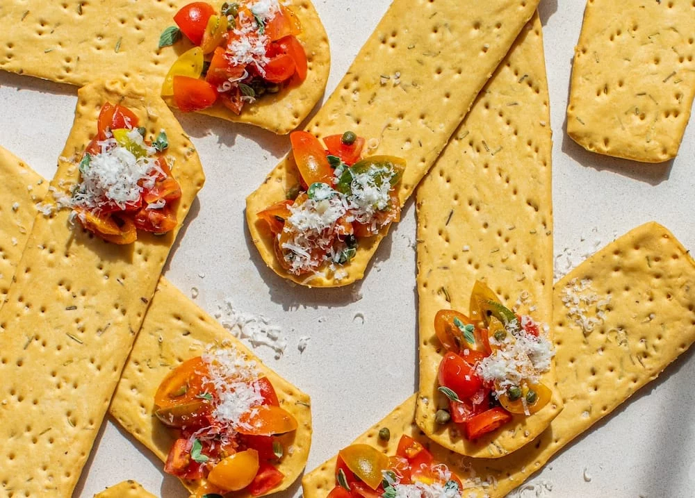 628b6837f05c7-628b6837f05c8Rosemary-Linguette-topped-with-tomatoes-capers-and-Parmesan.jpg-scaled